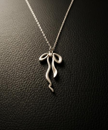 The Aura Bow Pendant: Elegant Nordic Femininity