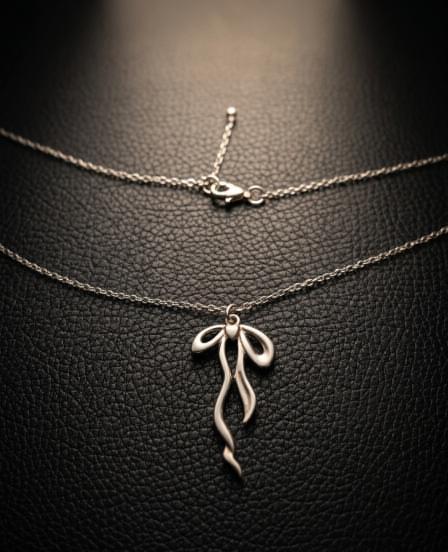 The Aura Bow Pendant: Elegant Nordic Femininity